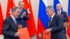 Russian President Vladimir Putin (right rear), Turkish President Recep Tayyip Erdogan (left rear), Russian Defense Minister Sergei Shoigu (right) and Turkish Defense Minister Hulusi Akar attend a news conference following the talks in Sochi on September 17.