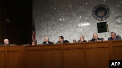 U.S. -- Senators listen before the Senate Foreign Relations Committee voted on a resolution on Syria on Capitol Hill in Washington, September 4, 2013