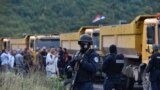 Kosovo special police stands as hundreds of Kosovo Serbs protest against a government ban on entry of vehicles with Serbian registration plates in Jarinje, Kosovo, September 20, 2021. 