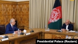 U.S. Special Envoy Zalmay Khalilzad (left) meets with Afghan President Ashraf Ghani in Kabul earlier this year.
