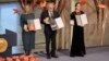 Natalia Pinchuk, the wife of Nobel Peace Prize winner Ales Byalyatski; Yan Rachinsky, chairman of the International Memorial Board; and Oleksandra Matviychuk, head of Ukraine's Center for Civil Liberties, pose with their awards in Oslo on December 1o.