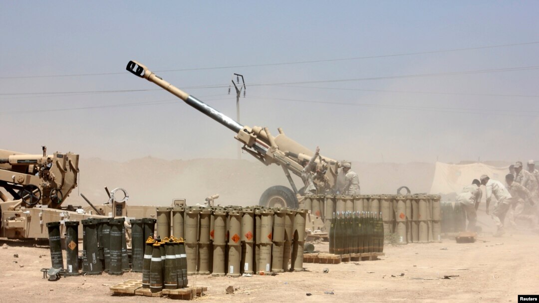 Iraqi security forces fire artillery during clashes with Sunni militants of the Islamic State of Iraq and the Levant (ISIL) on the outskirts of the town of Udaim in Diyala Province on June 22.