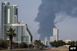 Smoke rises from the direction of an energy installation in the Gulf emirate of Fujairah on March 14.
