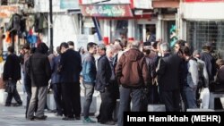 People without work on a street in Hamadan, Iran, not respecting social distancing rules. April 13, 2020