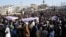 Mourners on February 7 attend a funeral for victims of an attack at a Shi'ite mosque a day earlier in Islamabad.