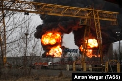 Smoke rises over a Belgorod oil depot hit by fire in April.