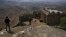 Pakistani soldiers observe the border with Afghanistan from a hilltop post in the Khyber district. (file photo)