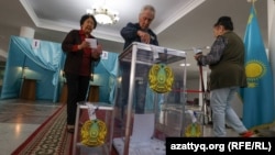 Voters cast their ballots at a polling station in the capital, Nur-Sultan, on June 5.