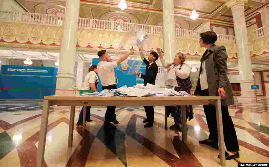 Members of a local election commission open a ballot box after polls closed during a constitutional referendum at a voting station in Nur-Sultan, Kazakhstan, on June 5.&nbsp;