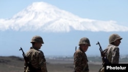 Armenia - Armenian soldiers taking part in a military exercise are pictured against the backdrop of Mount Ararat, May 26, 2022.