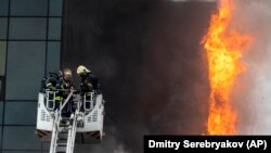 Russian firefighters tackle a blaze at a business center in Moscow on June 3. 