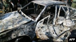 Фотография сожженной машины, которую официально распространяет сирийское агентство SANA