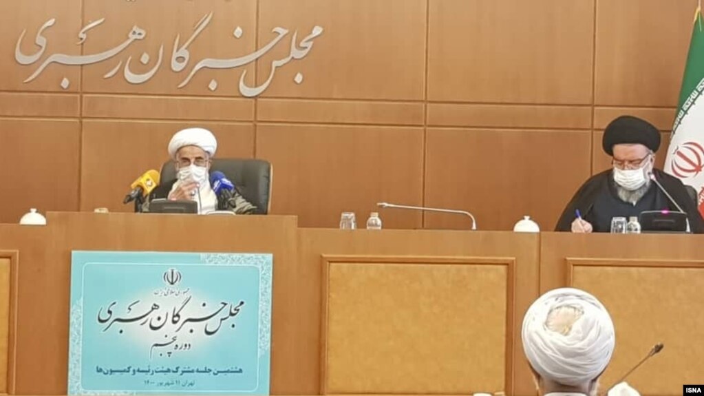احمد جنتی (نفر سمت چپ)