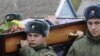 Russian servicemen carry the coffin of Vadim Kostenko at his funeral in the village of Grechnaya Balka on October 28.