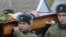 Russian servicemen carry the coffin of Vadim Kostenko at his funeral in the village of Grechnaya Balka on October 28.