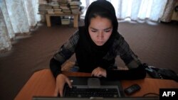 Afghanistan -- (Illustrative) A woman browses Facebook in Kabul. July 2012. 