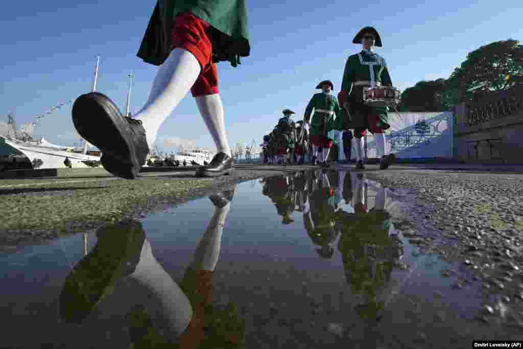 Musicians wearing 18th-century uniforms walk during festivities marking the 350th birthday of Russian Tsar Peter the Great in St. Petersburg, Russia, on June 9.