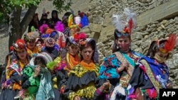 Kalash women wear traditional dresses during a religious festival celebrating the arrival of spring in Bumburet. (file photo)