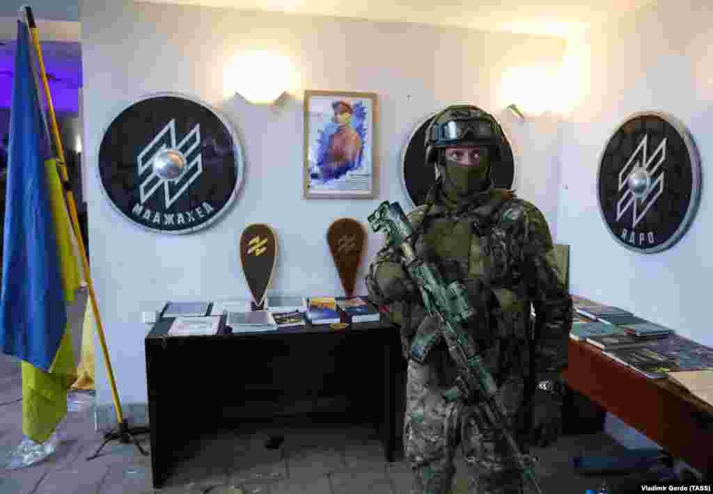 A Russian serviceman inside what the TASS news agency describes as the &quot;abandoned base&quot; of Ukraine&#39;s Azov Battalion in Mariupol on May 18.&nbsp;