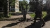 A Ukrainian soldier walks past part of a rocket near the front-line in the city of Syevyerodonetsk on June 2. 