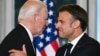 French President Emmanuel Macron (right) shakes hands with U.S. President Joe Biden during an official state dinner at the Presidential Elysee Palace in Paris on June 8.