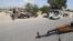 Afghan security forces stop vehicles at a checkpoint in Jalalabad.