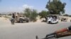 AFGHANISTAN -- Afghan security offcials check vehicles at a check point in Jalalabad, Afghanistan, 18 June 2017. 