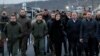 Ukrainian President Volodymyr Zelenskiy (3rd left) visits a section of the restored bridge in the settlement of Stanytsya Luhanska on November 20.