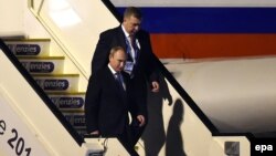 Russian President Vladimir Putin (left) arriving in Brisbane on November 14.