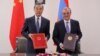 Foreign Ministers Zohrab Mnatsakanian (right) of Armenia and Wang Yi of China sign a visa-waiver agreement in Yerevan on May 26, 2019. 