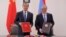 Foreign Ministers Zohrab Mnatsakanian (right) of Armenia and Wang Yi of China sign a visa-waiver agreement in Yerevan on May 26, 2019. 