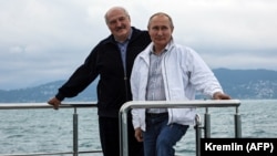 Russian President Vladimir Putin (right) and Belarusian strongman Alyaksandr Lukashenka pose on the yacht in question on the Black Sea on May 29.