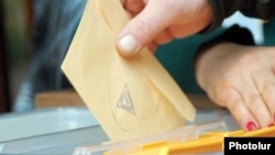 Armenia -- A voter casts a ballot.