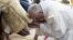 Pope Francis on Thursday washed and kissed the feet of refugees