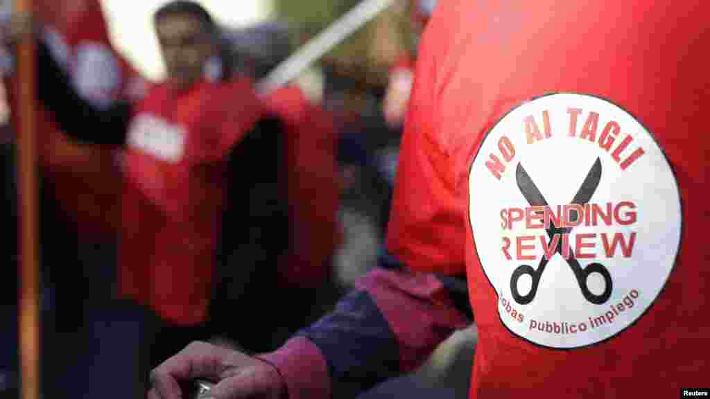 A protester in Rome wears a T-shirt that reads: &quot;No cuts. Spending review.&quot;