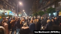 People in Belgrade on November 9 gather in support of Aida Corovic and Jelena Jacimovic, who were arrested for throwing eggs at a mural of Ratko Mladic.