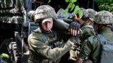 UKRAINE – Ukrainian service members prepare shells for a M777 Howitzer near a frontline, as Russia's attack on Ukraine continues, in Donetsk Region, June 6, 2022