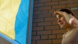 GRAB Flagging Trouble: Russian Woman Defies Kremlin With Ukrainian Colors
