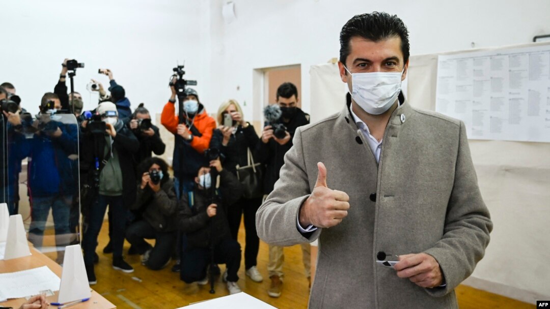 Kiril Petkov, the man tipped to become Bulgaria's next prime minister, gives a thumbs-up sign after casting his ballot in national elections on November 14. 
