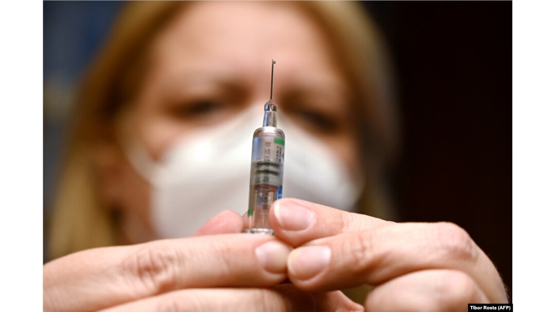 A nurse prepares a dose of the Sinopharm vaccine at an inoculation center in Budapest. (file photo)