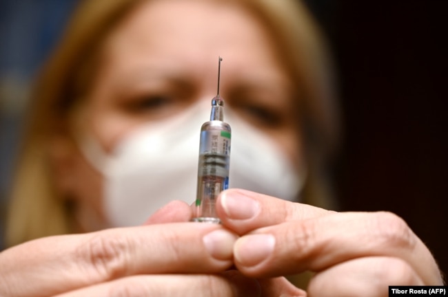 A nurse prepares a dose of the Sinopharm vaccine at an inoculation center in Budapest. (file photo)