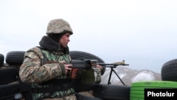 Armenia - An Armenian soldier stands guard on the border with Azerbaijan, November 12, ,2021.