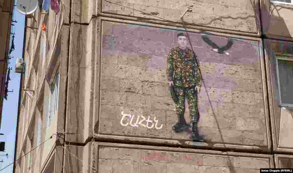 A painted memorial to Shahen in central Yerevan. During and shortly after the 2020 conflict, black banners were hung across streets where the fallen soldiers lived. These painted murals are a longer-term tribute.&nbsp; &nbsp;