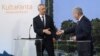 Finnish President Sauli Niinisto (right) and NATO Secretary-General Jens Stoltenberg shake hands at a press conference in Naantali, Finland, on June 12.