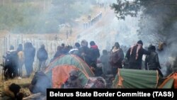  Migrants gather in a tent camp on the Belarusian-Polish border on November 10.