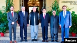 Pakistani Foreign Minister Shah Mahmood Qureshi (third left) with the envoys from the United States, China, and Russia before the "Troika plus" group conference in Islamabad on November 11.
