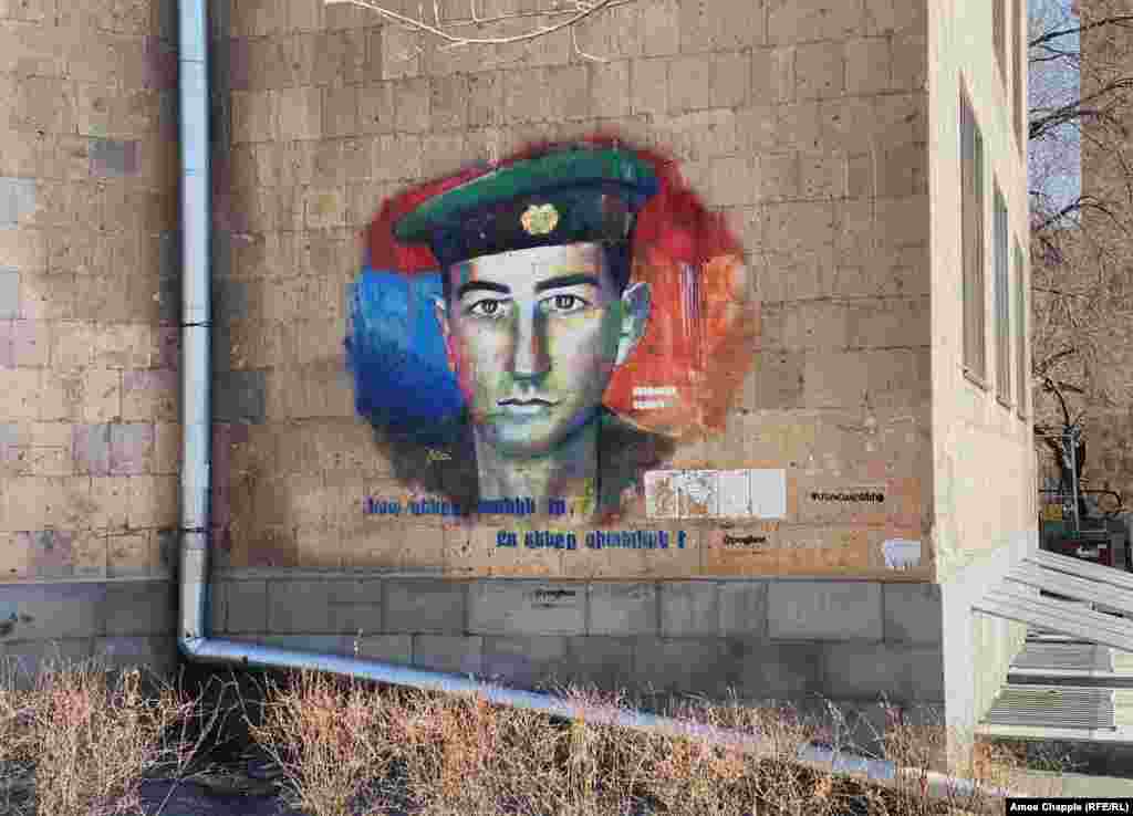 A portrait of fallen soldier Benjamin Yeghoian in central Yerevan with the words: &quot;His weapon was the tank, your weapon is knowledge.&quot;&nbsp; &nbsp;