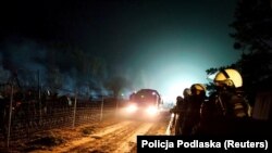 Migranti i policijske snage na granici Bjelorusije i Poljske 