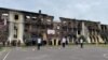 Kharkiv, Valeria and Denis with their friends, pre-prom dance in front of the ruins of Specialized school 134, guarded by the Ukrainian army , Jun 5, 2022 