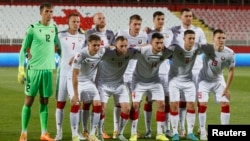Belarus players pose for a group photo before a match of the UEFA Nations League against Azerbaijan in Novi Sad, Serbia, in June.